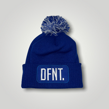 Load image into Gallery viewer, A royal blue beanie hat with a two tone blue and white bobble on top. The hat is branded with DFNT. embroidered on the centre patch in white. It is soft to the touch and has a double layer knit and ribbed cuff.