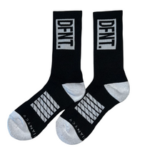 Load image into Gallery viewer, DFNT. performance socks in black.  The logo is negative space in white to match the heel and toe.  The Defiant Co is woven in to the bottom of the sock in white along with some stripes that track the slightly elasticated sole to help keep them in place during workouts.