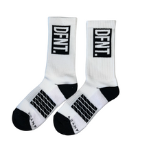 Load image into Gallery viewer, DFNT. performance socks in white.  The logo is negative space in black to match the heel and toe.  The Defiant Co is woven in to the bottom of the sock in black along with some stripes that track the slightly elasticated sole to help keep them in place during workouts.